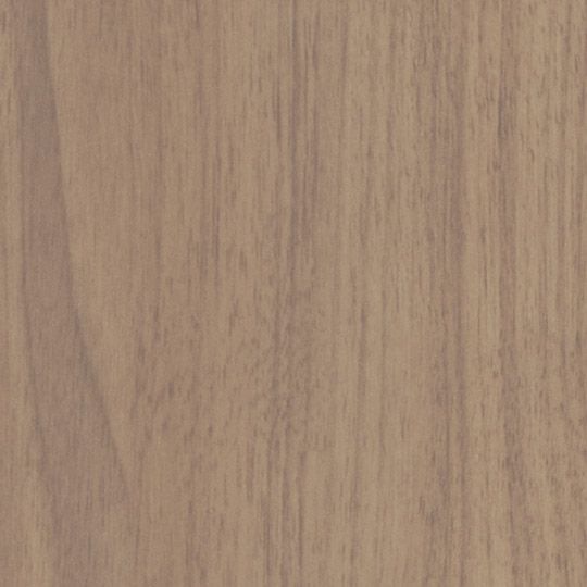 Et nærbillede af et stykke træ, der viser årer og tekstur.