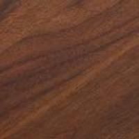 Et nærbillede af et stykke træ, der viser årer og tekstur.