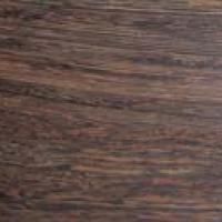 Et nærbillede af et stykke træ, der viser årer og tekstur.