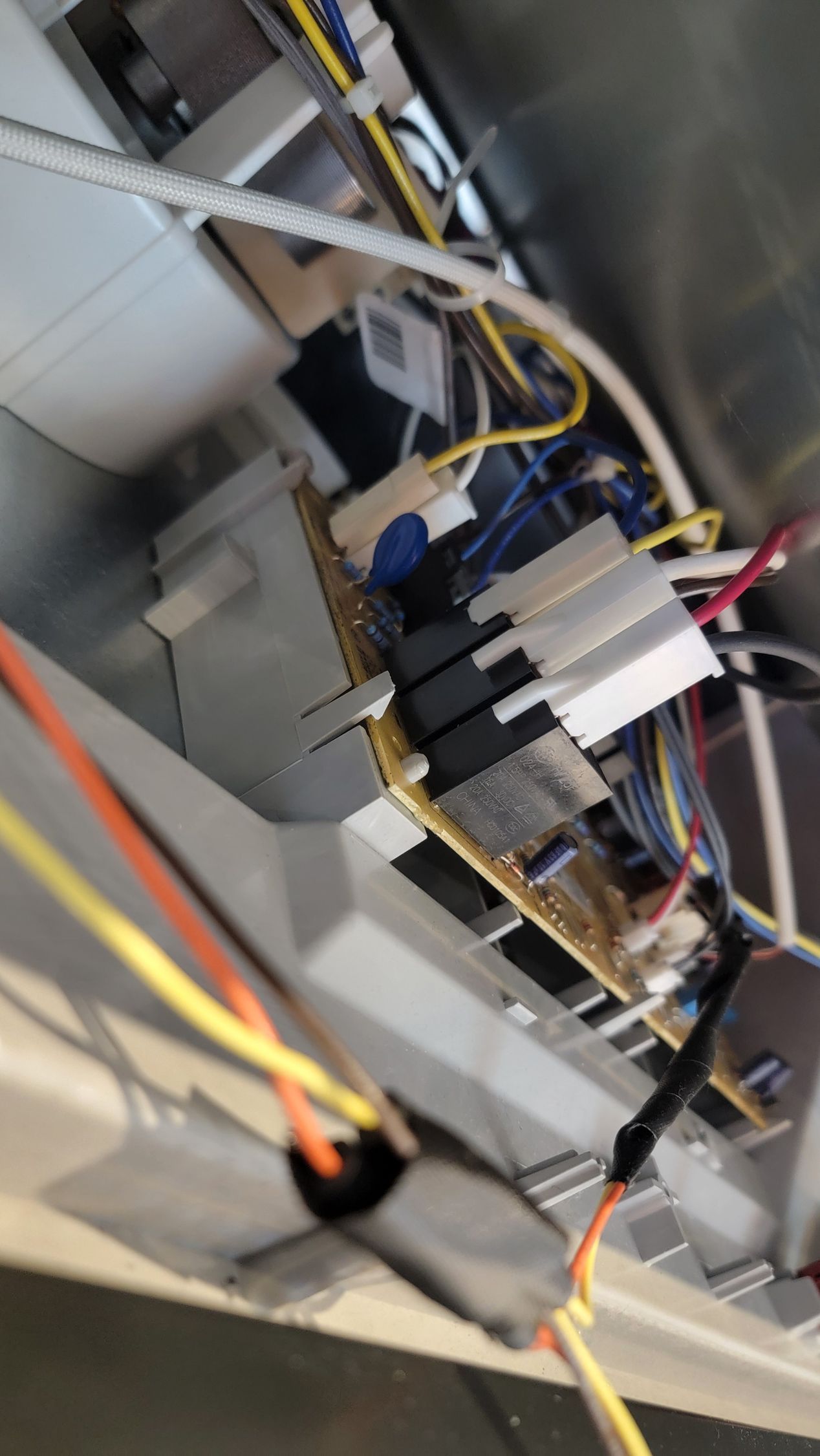 A bunch of wires are hanging from the ceiling