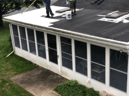 Professional Roof Coating — Roof being coated with white in Lititz, PA