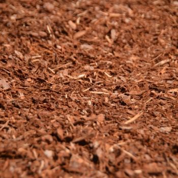 Close-up of brown wood chips or mulch filling the frame