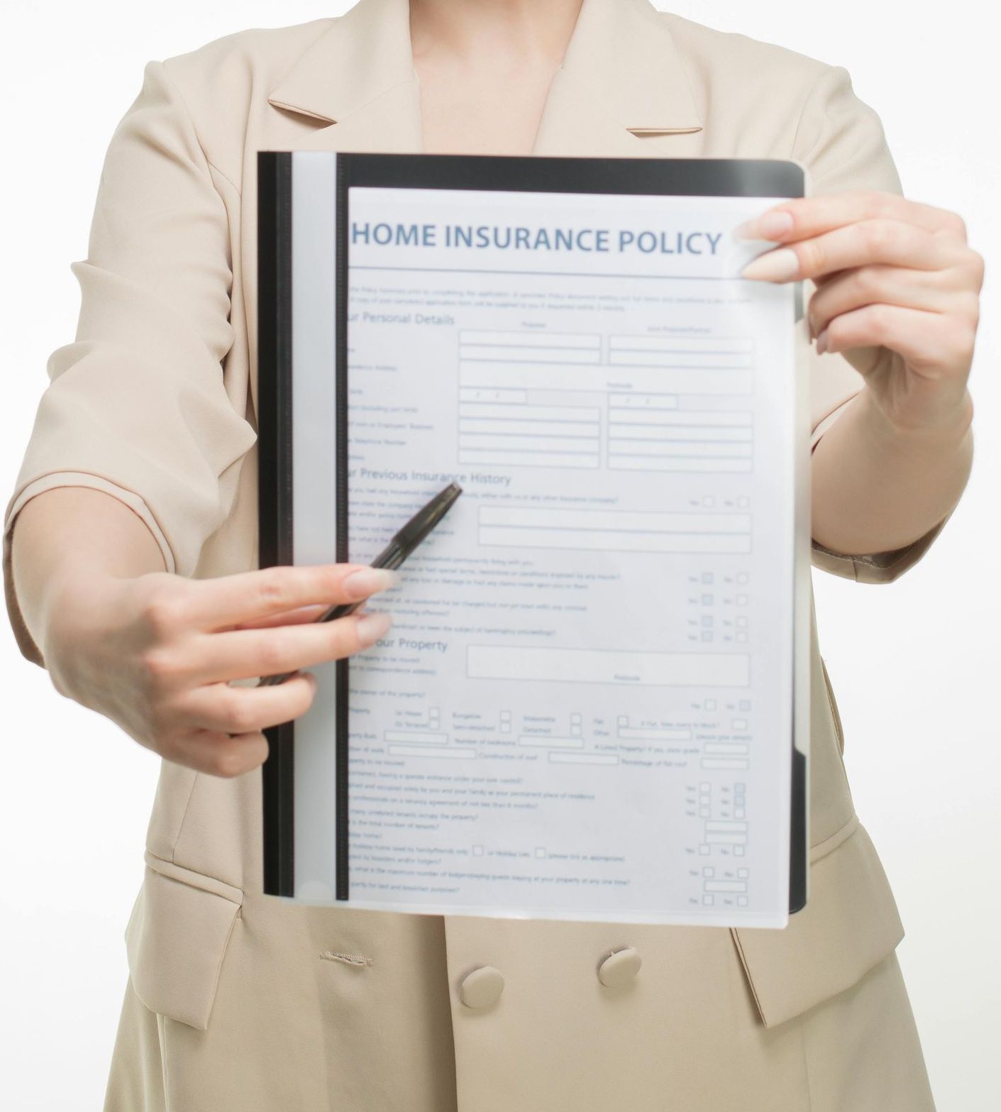 A woman is holding out an insurance policy in her hands with a pen.