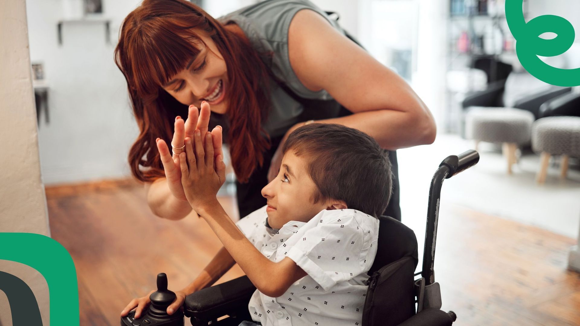 A warm high-five between a worker and a person with disability showing NDIS consumer rights.