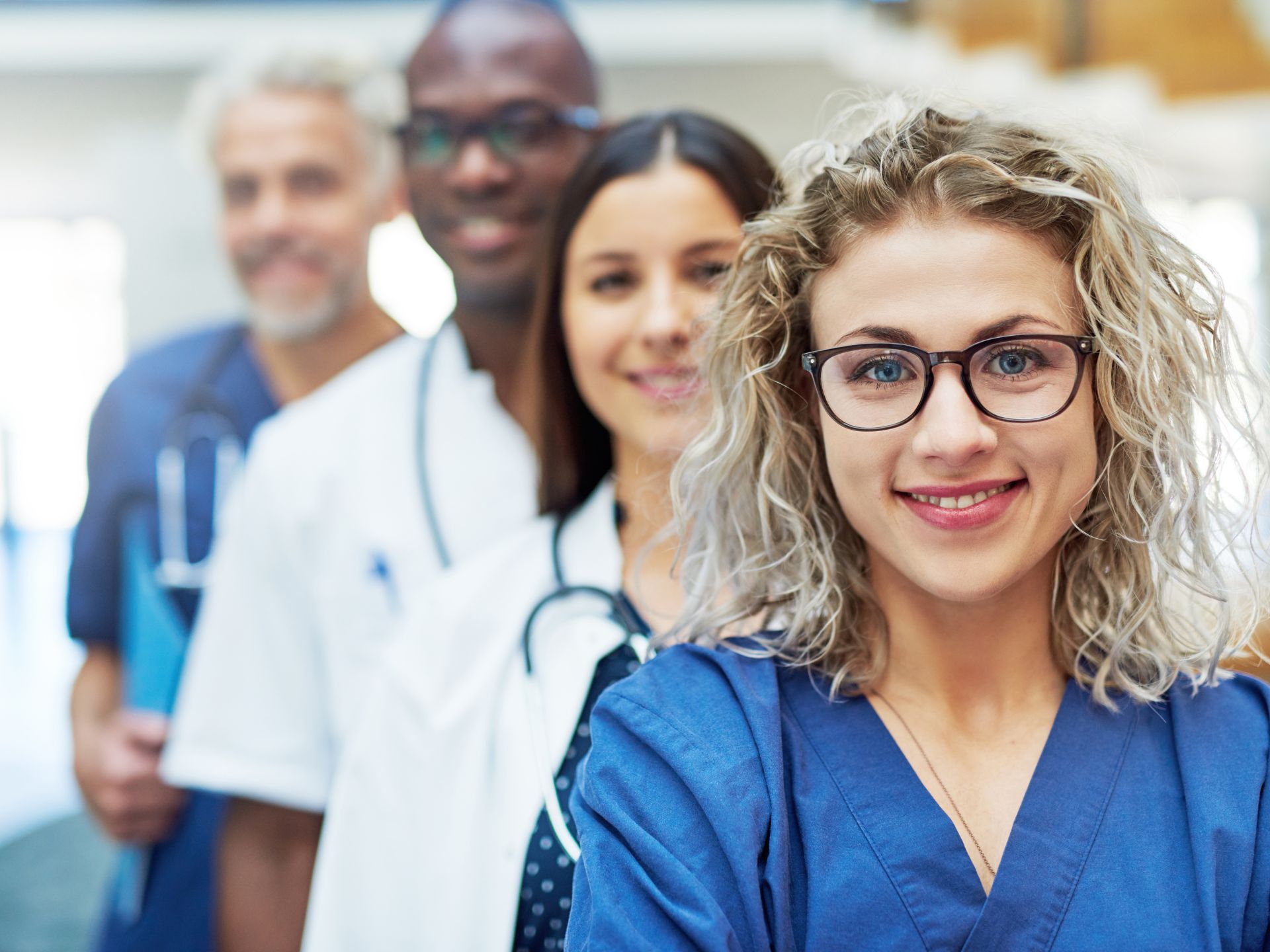 A team of diverse healthcare professionals, symbolizing the access to mainstream and specialist services facilitated by Plan and Grow's service coordination.