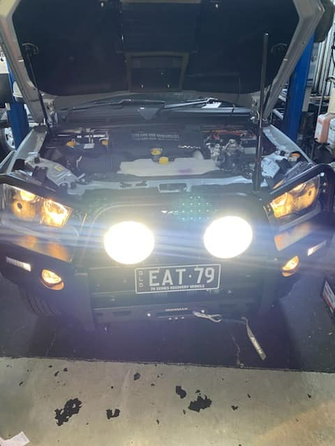 A Car With The Hood Open Has A License Plate That Says EAT 79 β Town Automatics 4WD & Mechanical in South Townsville, QLD