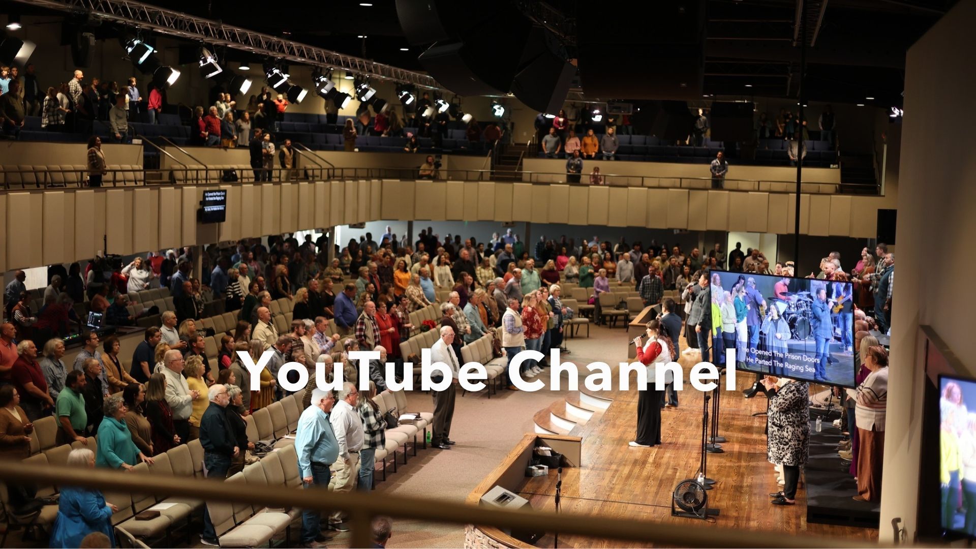 A large crowd of people are gathered in a church with youtube channel written on the bottom