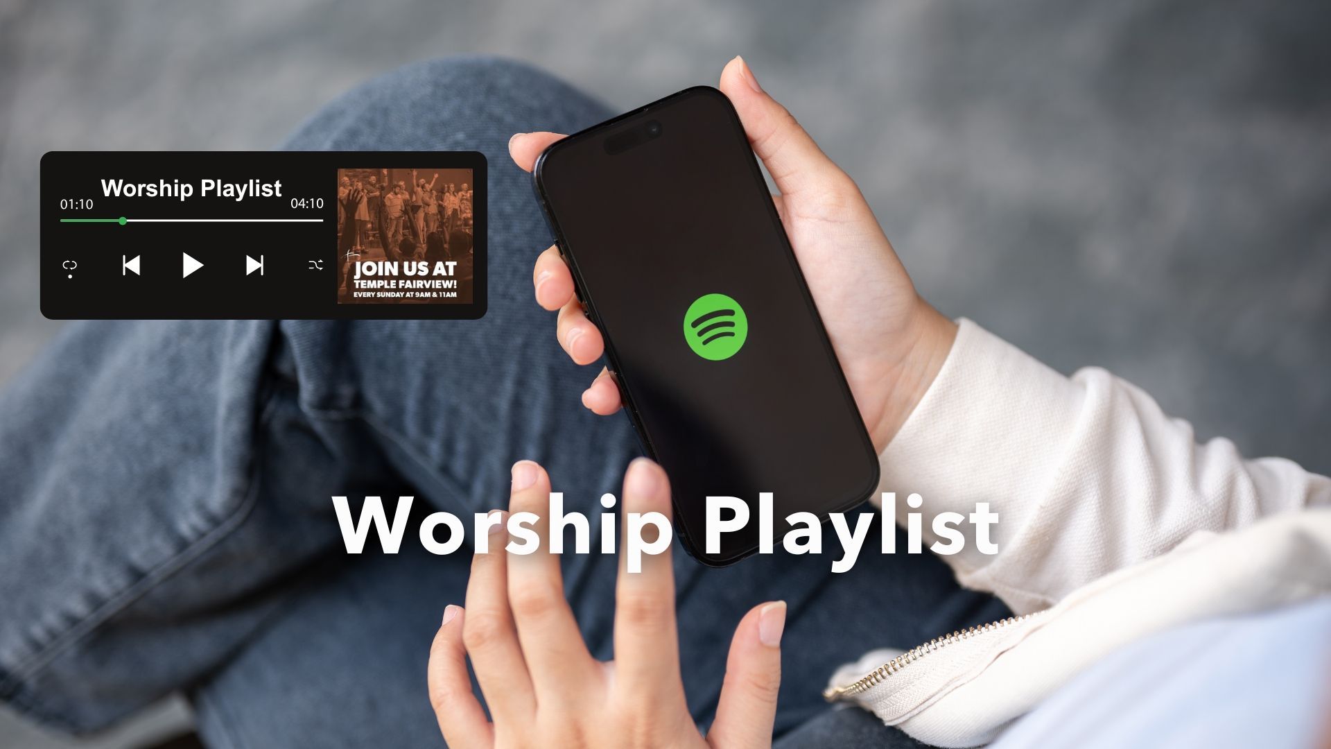 A large group of people are singing in a church with the words spotify playlist above them