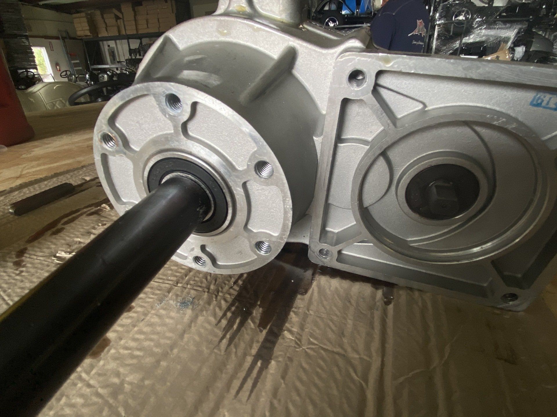 A close up of a gearbox on a piece of cardboard.