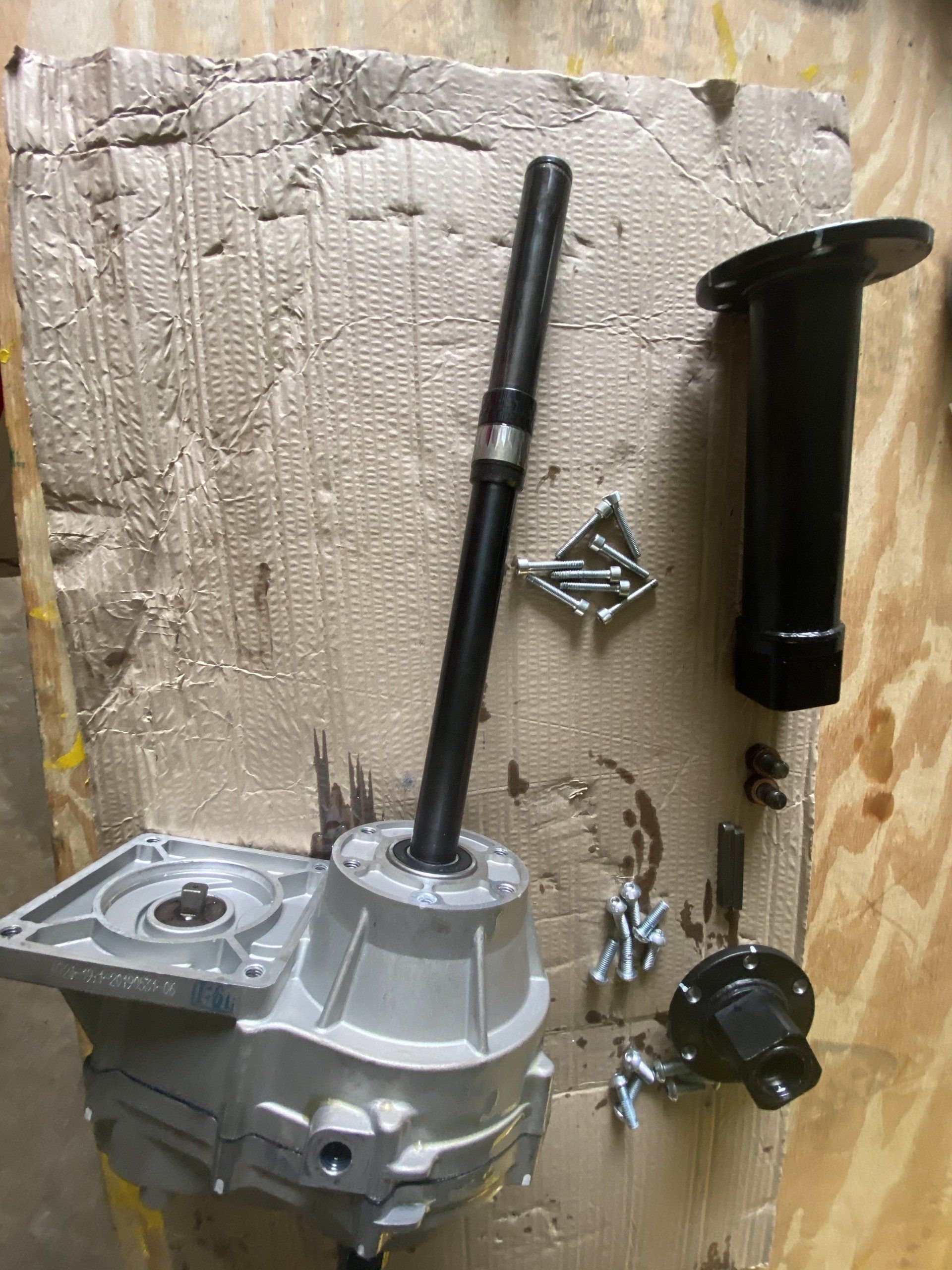 A piece of metal is sitting on top of a piece of cardboard.