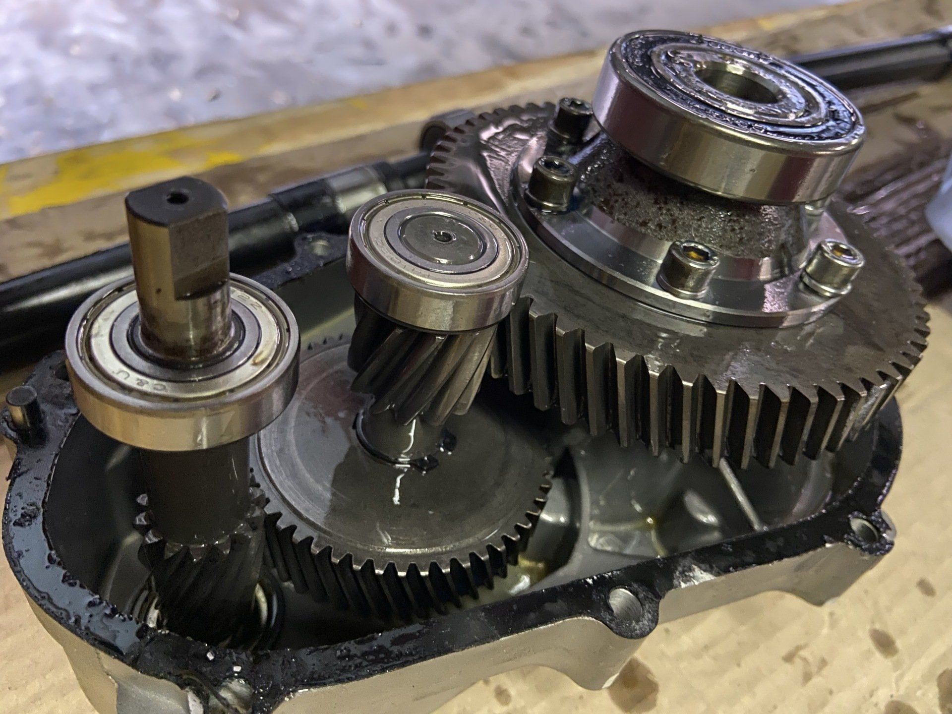 A close up of a gearbox on a wooden table