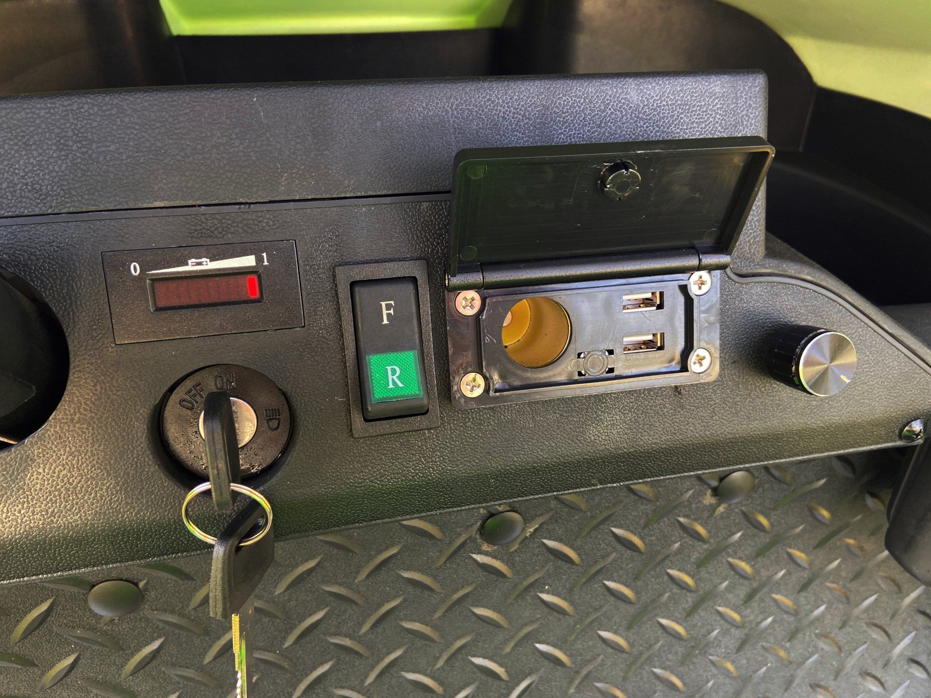 A close up of the dashboard of a golf cart
