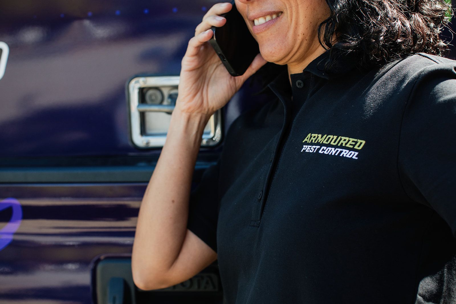 Woman in black polo shirt with