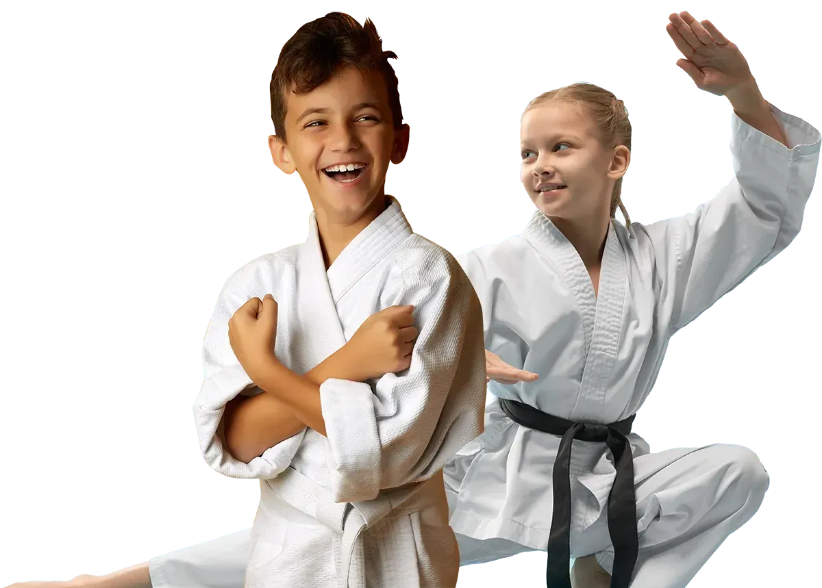 A boy and two girls are wearing karate uniforms and pointing at the camera