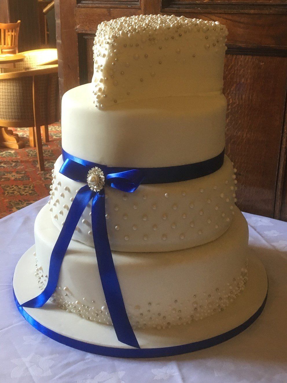 heart wedding cake with blue bow