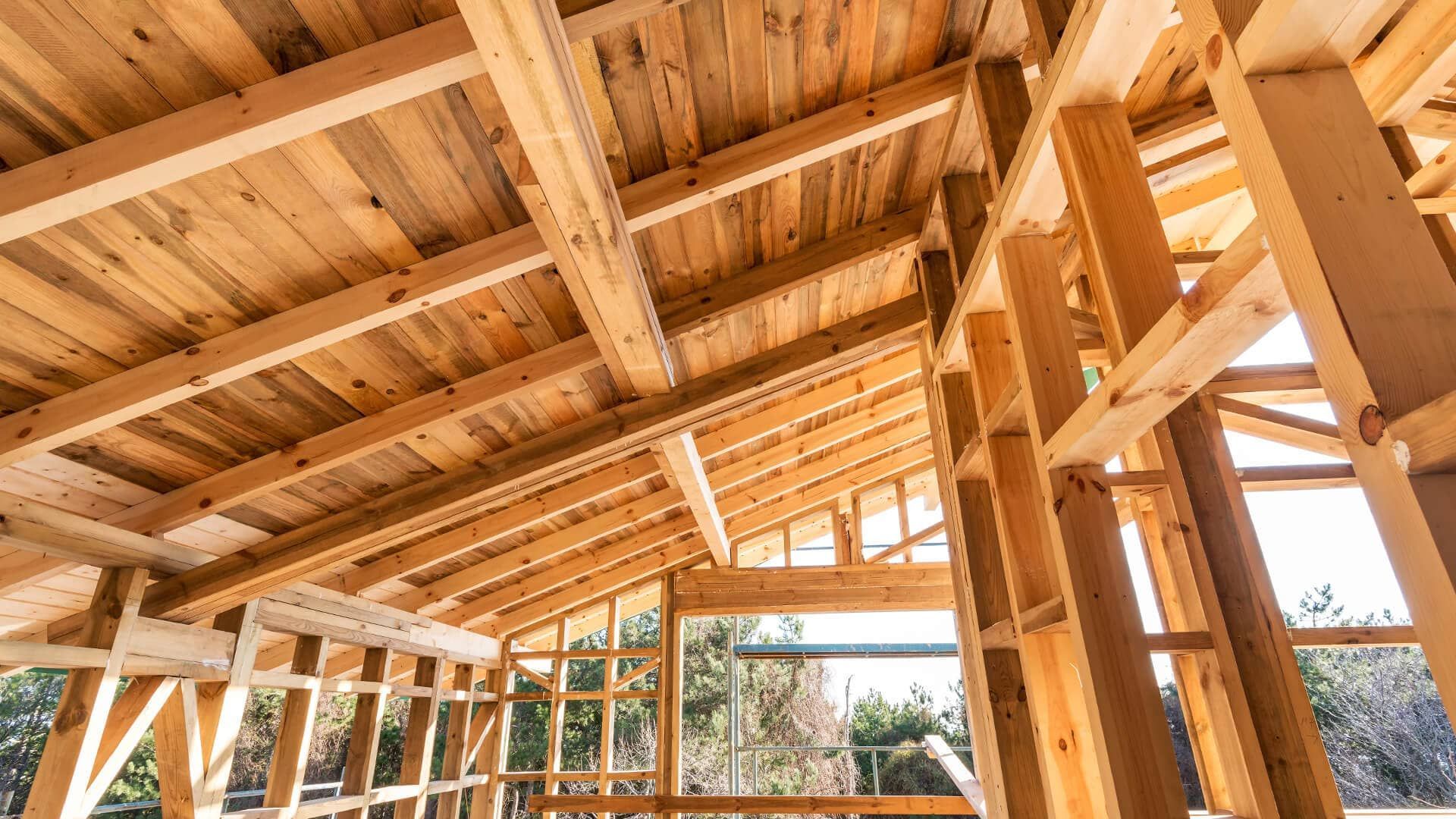 The inside of a wooden house under construction.