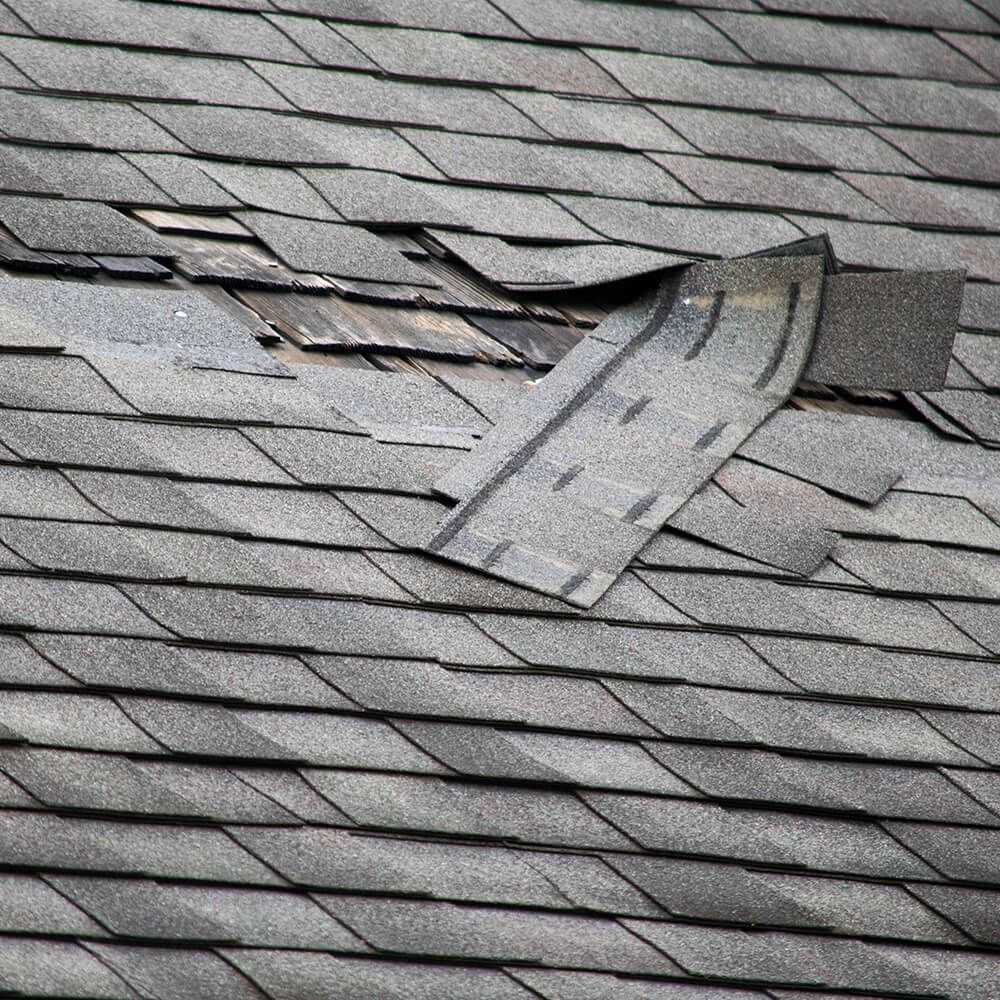 A close up of a roof with a hole in it.