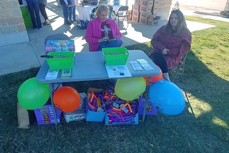 Two Women Sitting at Table