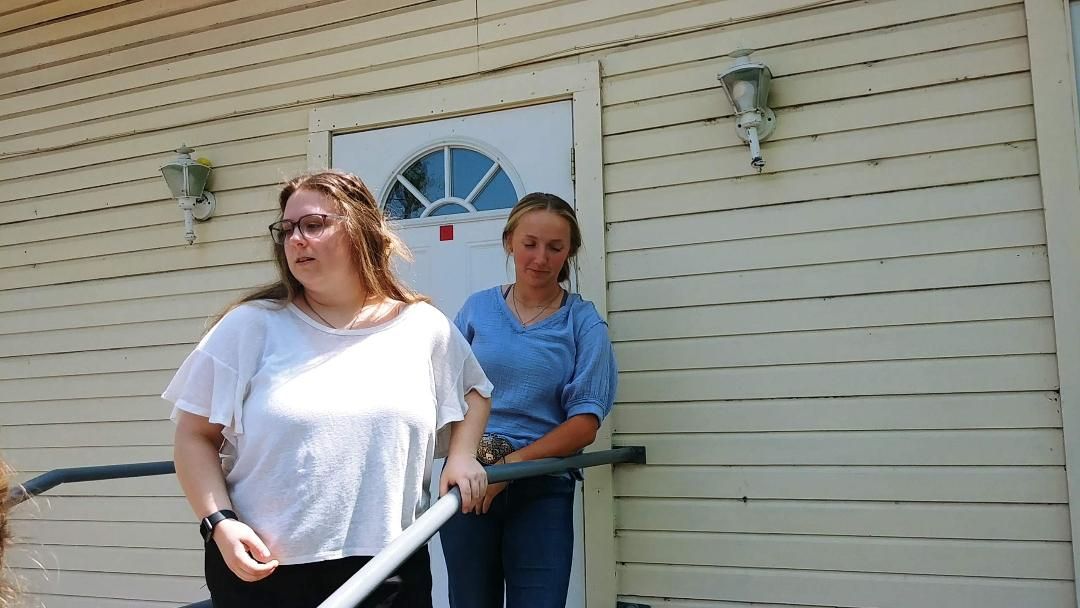 Two Girls Walking Down Stairs