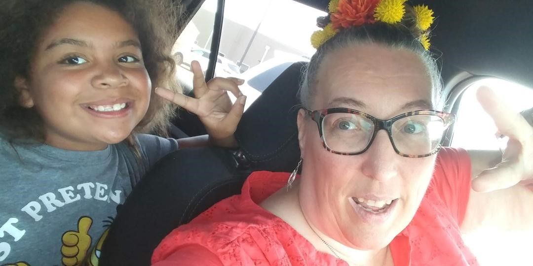 Woman and Child Smiling in Car