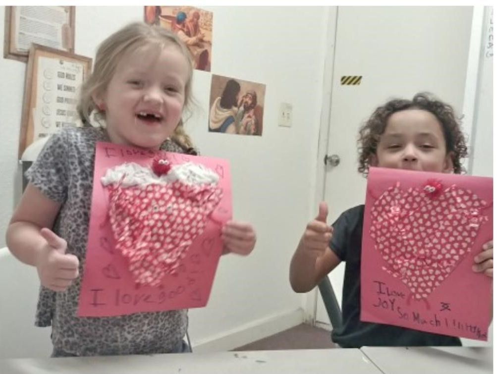 Children Holding Valentine's Artwork