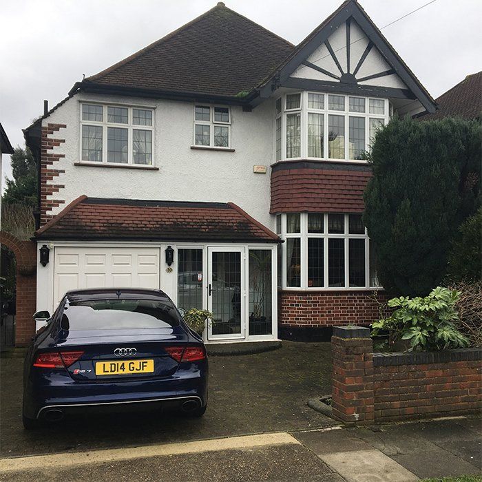 house with car parked on the driveway