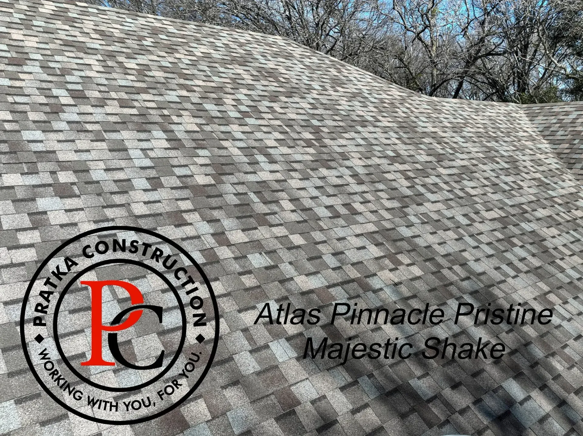 Roof shingles with a construction logo and text, 