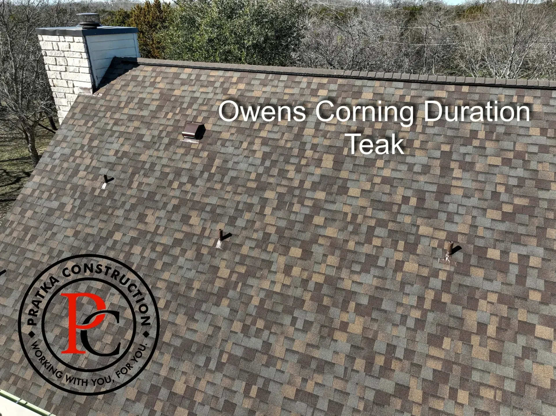 Overhead view of a brown and tan Owens Corning Duration Teak shingle roof.