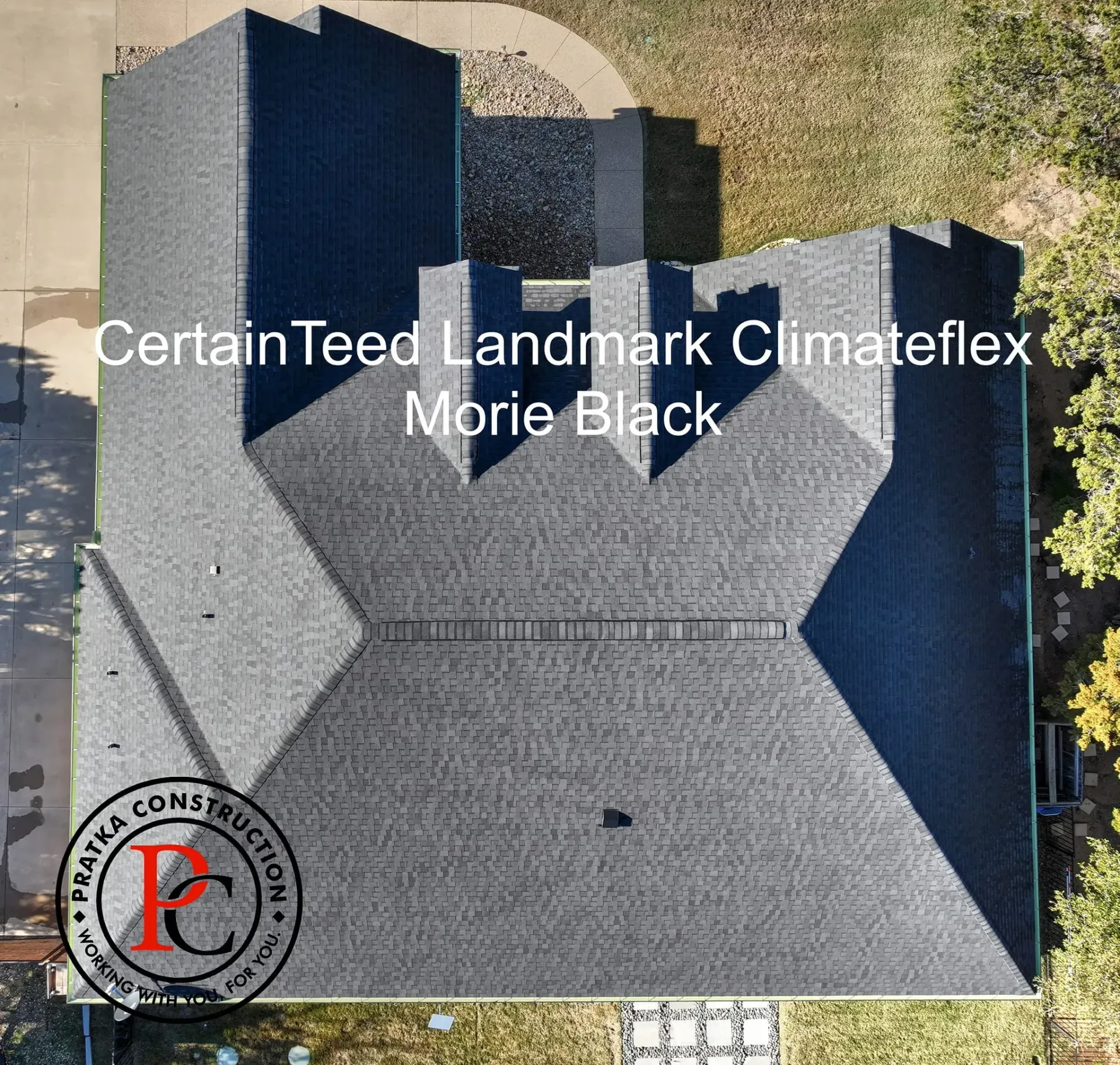 Aerial view of a house with a black CertainTeed Landmark Climateflex roof.