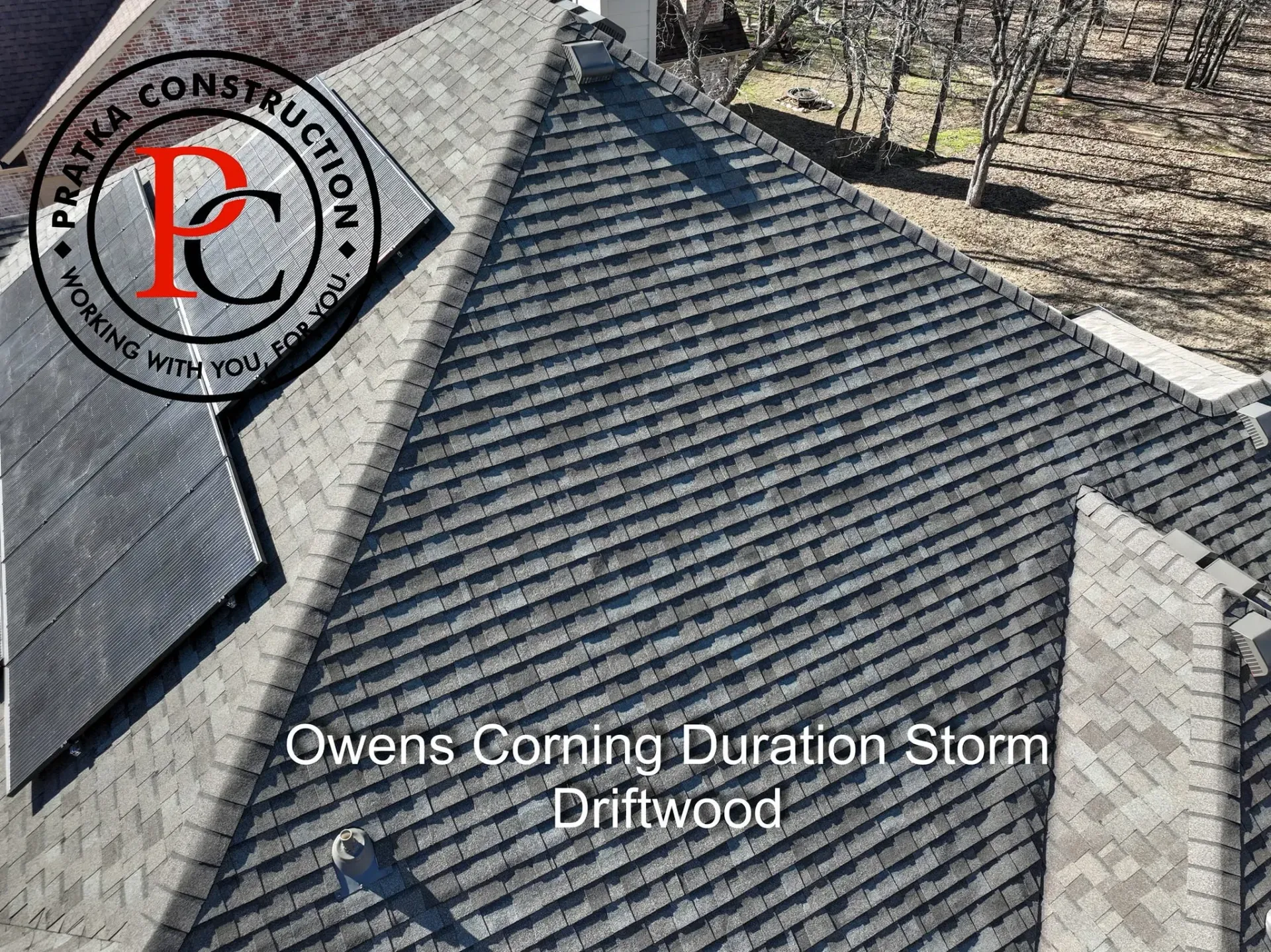 Overhead view of a roof with grey Owens Corning shingles labeled 