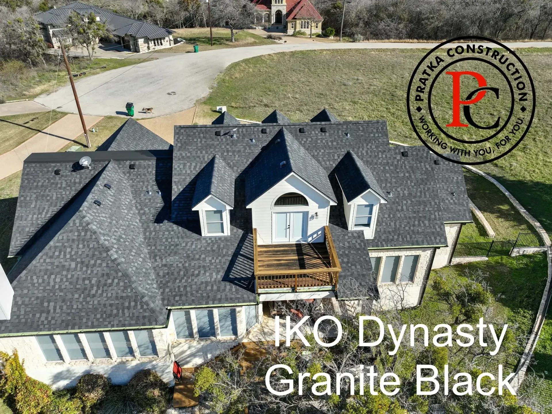 Overhead view of a house with a dark gray roof, labeled 