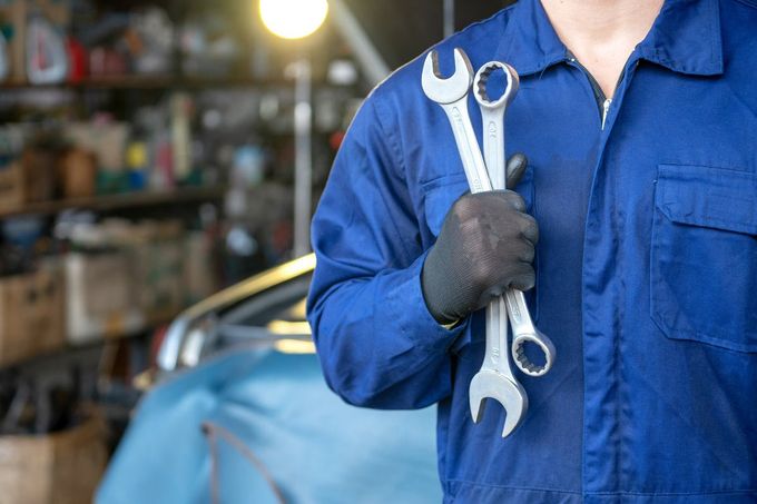 Mechanic holding wrenches — Libertyville, IL — Auto Repair Services