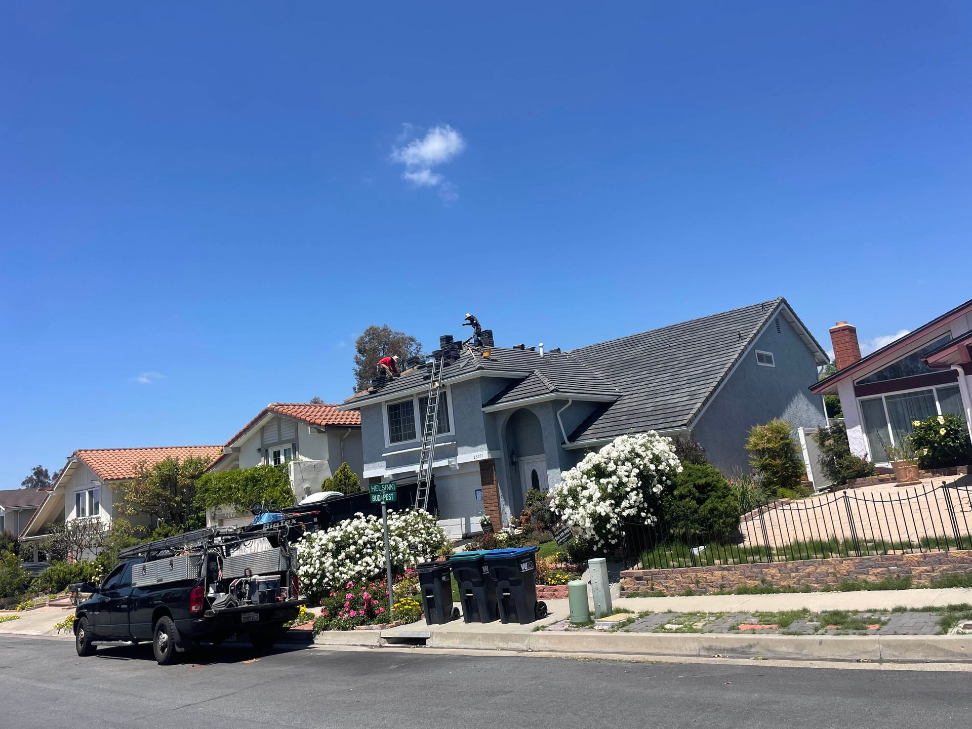 A truck is parked in front of a house that is being remodeled.