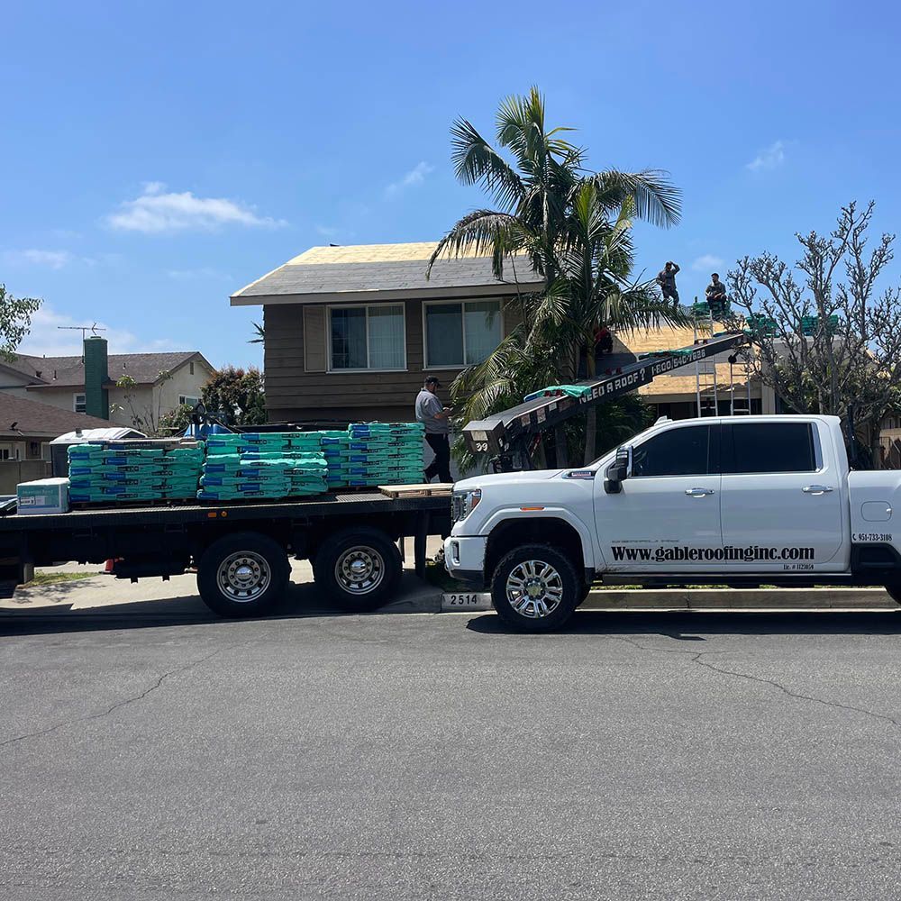 A white truck is parked on the side of the road