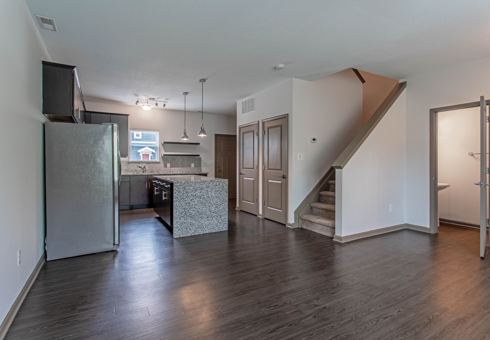 A kitchen with stainless steel appliances and granite counter tops