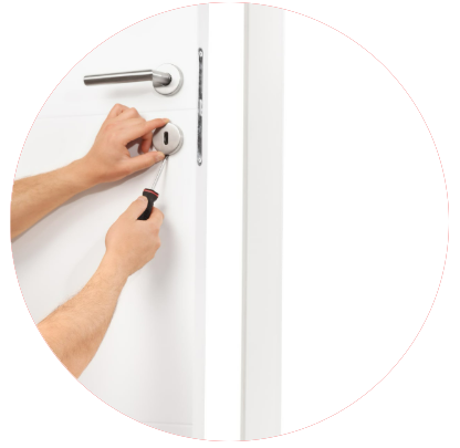 A person is fixing a door with a screwdriver A person is fixing a door with a screwdriver