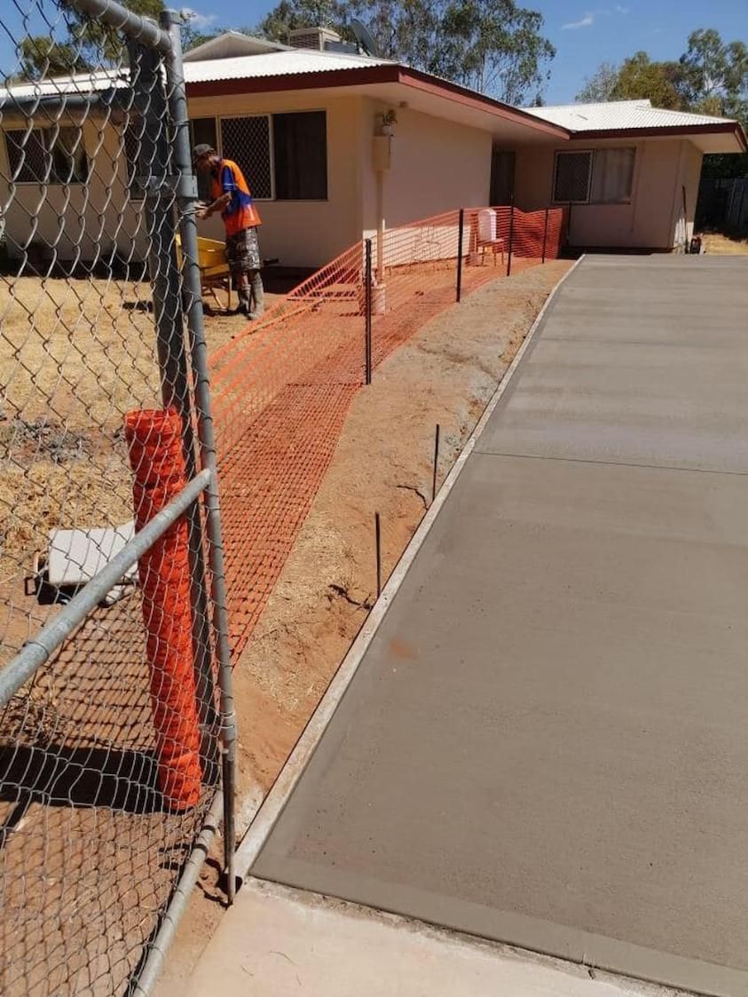 A Concrete Driveway Is Being Built In Front Of A House — Heartland Concrete In Gillen, NT