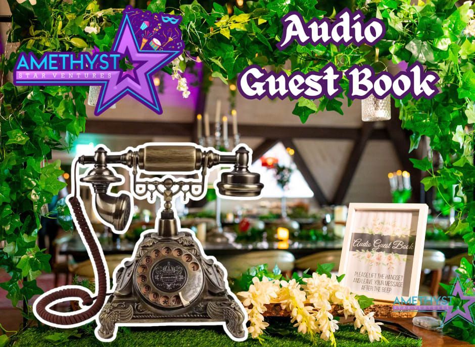 An antique-style telephone sitting on moss with a floral arrangement and a small sign reading 