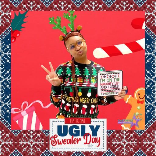 A person wearing a Christmas sweater and reindeer antlers poses with a 