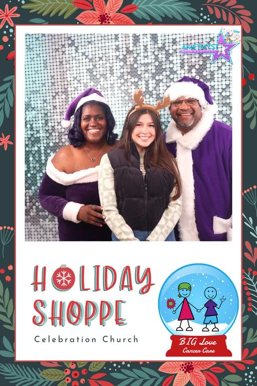 Three people smiling in front of a shimmery backdrop in a Holiday Shoppe photo frame for Celebration Church.