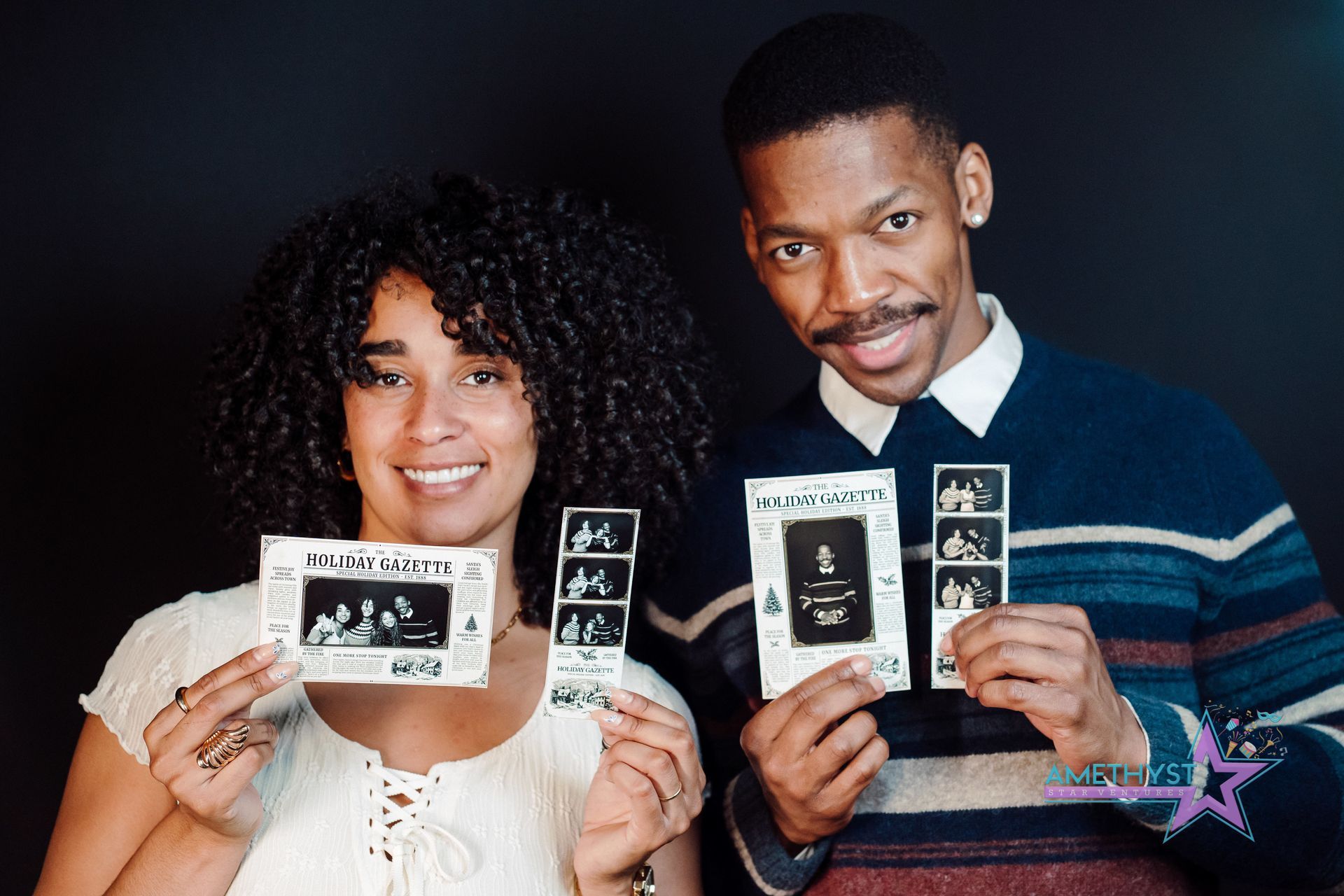 Two people holding black-and-white ultrasound photos against a dark background