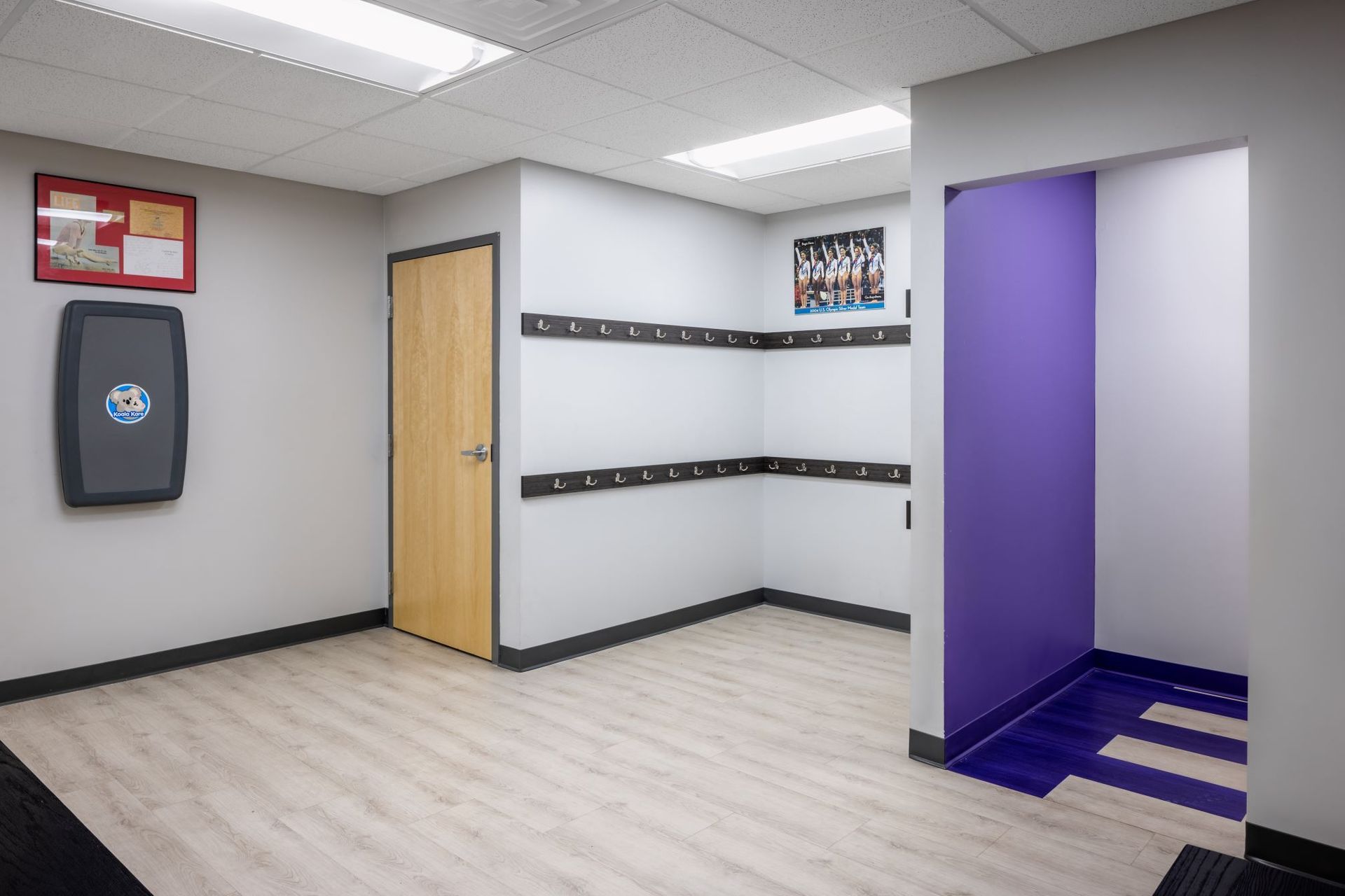 There is a purple wall in the middle of the room.