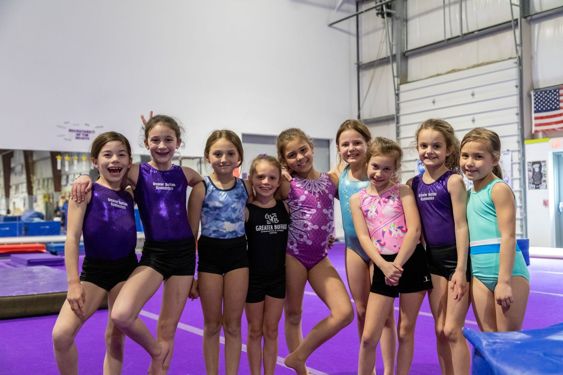 row of young girls in leos for gymnastics
