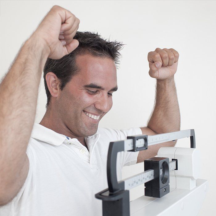 Man Happy with His Weight — Decatur, AL — Decatur Internal Medicine & Aesthetics