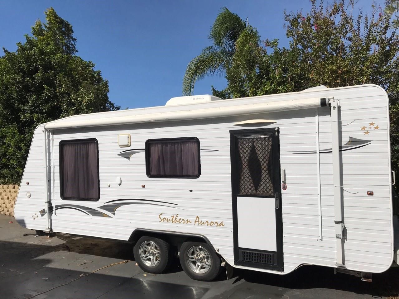 White Southern Aurora Caravan Parked Outdoors — Darren's Caravan Repairs in Warners Bay, NSW