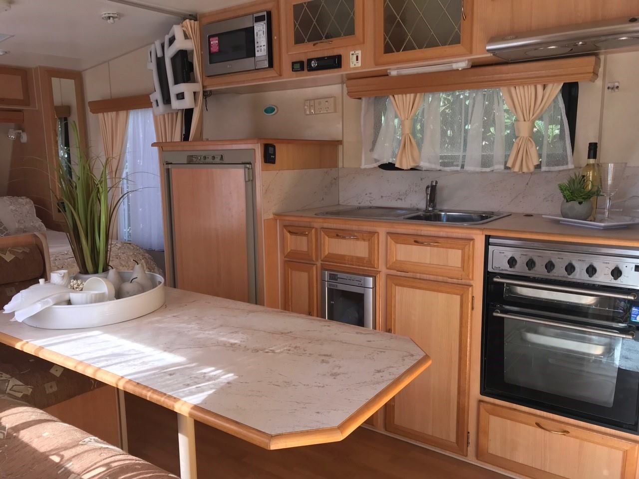 Interior of a Camper With a Kitchen Area — Darren's Caravan Repairs in Warners Bay, NSW