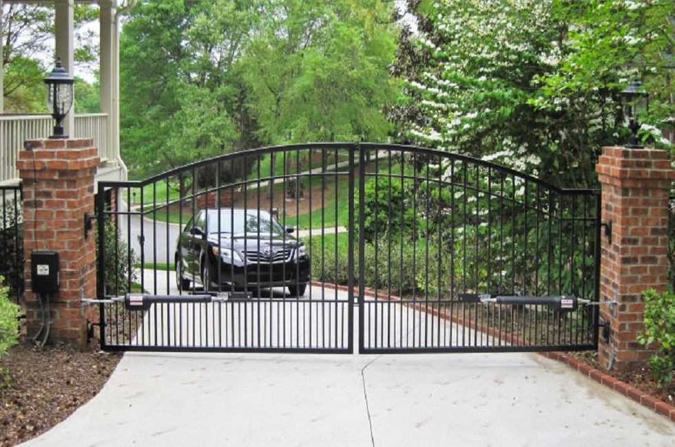 A car is parked in a driveway behind a gate. lake havasu