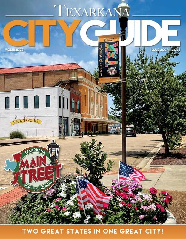 Texarkana City Guide cover: Downtown street scene, flowers, flags, and building facades.