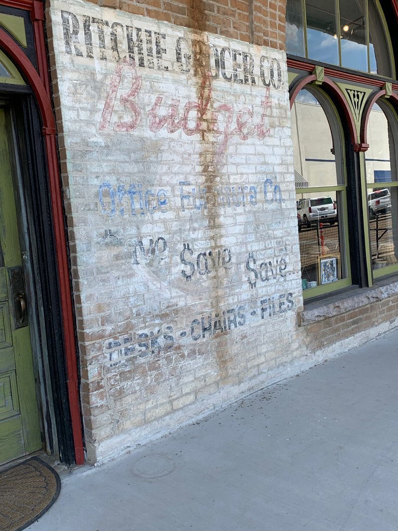 Old painted brick sign: