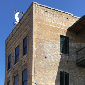 Brick building corner with faded
